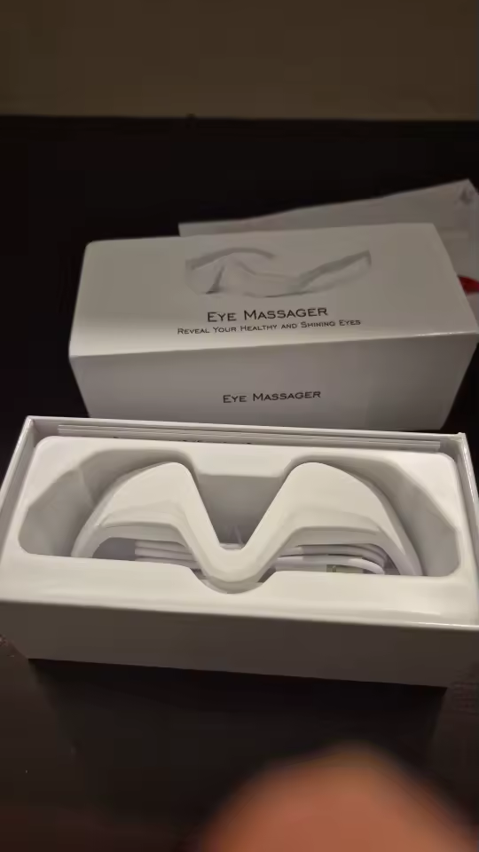 Eye Massager unboxed in tray with packaging