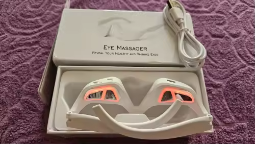 Eye Massager in tray with the lights turned on